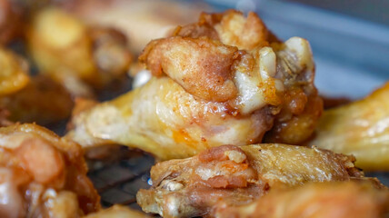 Chicken wings barbecue roasted with sauce. Fried chicken wings, homemade, food for restaurant, menu, advert or package, close up. American cuisine.