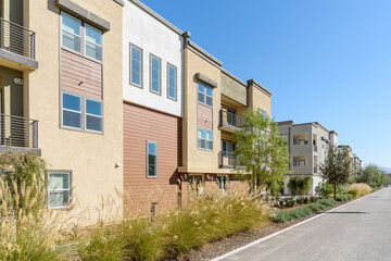 New apartment buildings in a suburban development on a clear autumn day
