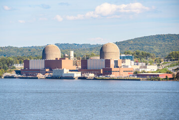 Nuclear power station on the bank of a large river on a clear autumn day