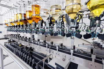 Modern system factory of cosmetic oil and aroma water on conveyor line. Automated plant for production of perfume. - obrazy, fototapety, plakaty