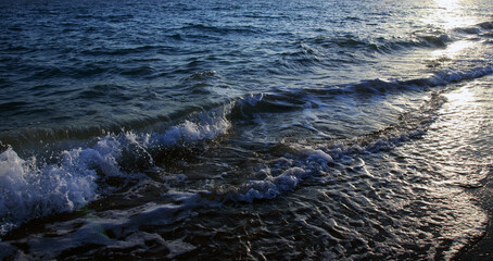 Seascape. Turbulent the sea. Vacation and summer concept. Powerful Ocean blue waves with white...