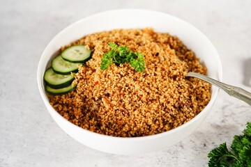 Homemade Moroccan couscous served in a bowl, selective focus