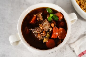 Homemade Moroccan lamb stew or Soup for Tagine, selective focus