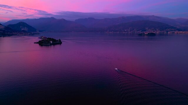 Beautiful pink sunset on Lake Maggiore. Aerial view of the island, Isola Bella, Isola Superiore. New Year holidays on the Italian island