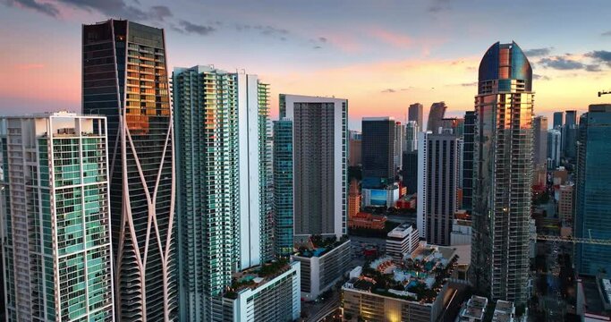 Multi-storied apartment blocks in the downtown of Miami, Florida, USA. Approaching high-rise buildings at dusk.