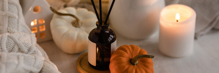 Banner. Autumn mood, cozy fall home atmosphere. Aroma diffuser, pumpkins, marshmallow chocolate hot...
