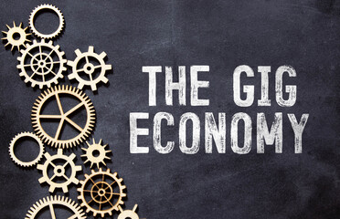 The Gig Economy text on notepad, concept background