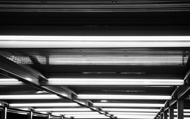 Abstract minimalist pattern of some fluorescent lights in an industrial city black and white...