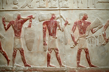 Procession with men carrying meet offerings for the deceased owner of a V Dynasty mastaba - Idut. Saqqara, Egypt - obrazy, fototapety, plakaty