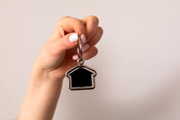 woman holding is home key