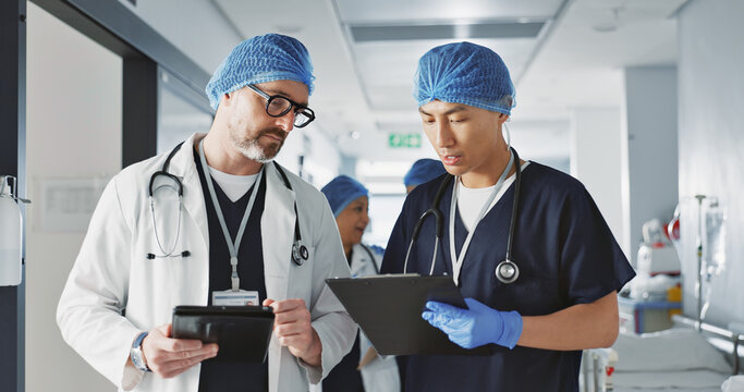 Teamwork, talking and doctors with a tablet at a hospital for health advice or surgery communication. Help, clinic and medical employees speaking with technology, planning and schedule for nursing