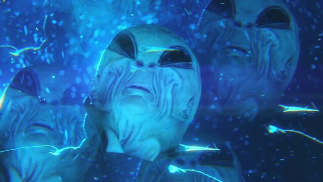 Kaleidoscope effect video of mysterious alien standing under strobe ufo light and looking around during snowy night. View from below