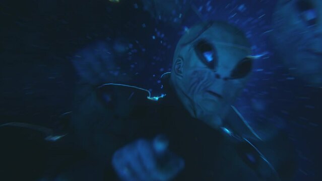 Kaleidoscope effect footage of curious alien pointing at camera while standing under snowfall and strobe ufo light at night