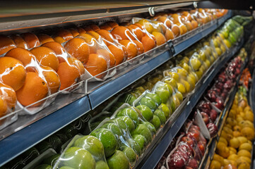 Packaged fruit on the supermarket shelf.