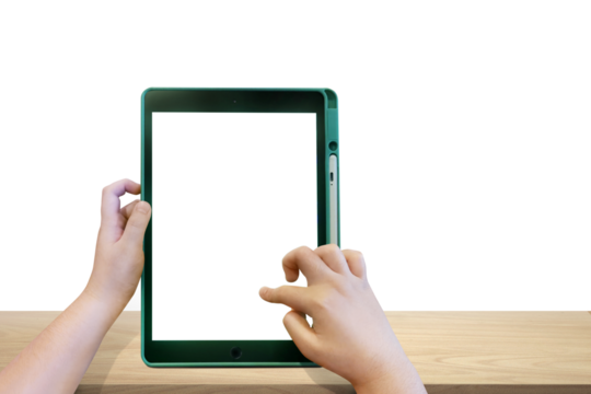 Boy's hands holding a tablet on a wooden table PNG transparent