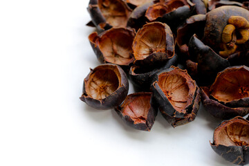 Dried mangosteen peels on white background.