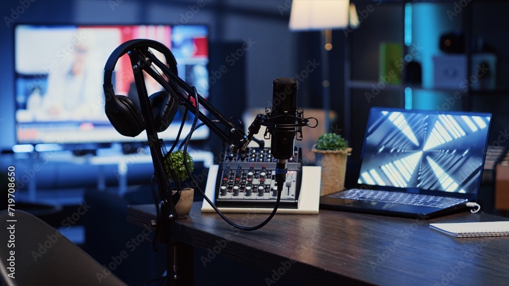 Poster panning shot of podcast microphone used to record discussions for internet livestreaming channel and