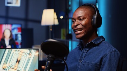 African american man invited to podcast, participating in entertaining discussion with host in...