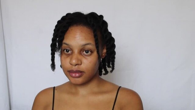 Black woman with twists natural 4c hair on a white background