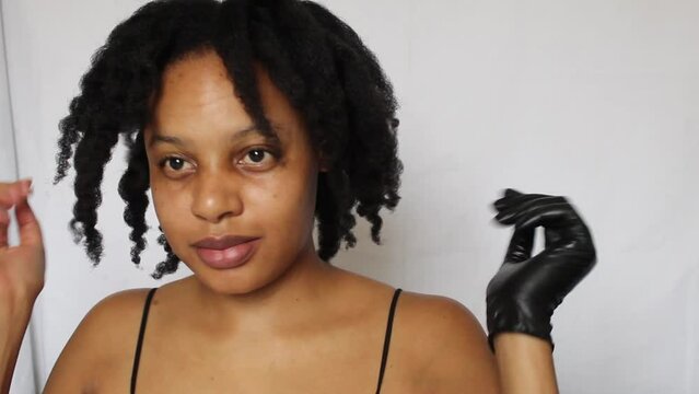 Black woman with her natural 4c hair on a white background