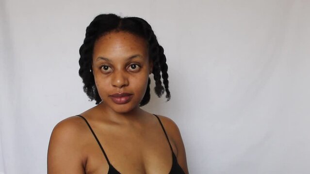 Black woman with twists her natural 4c hair on a white background