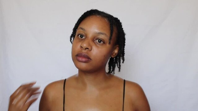 Black woman with twists her natural 4c hair on a white background