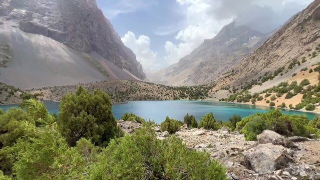 The Alaudin (Chapdara) lakes, lying at an altitude of 2800 m, are considered one of the most beautiful lakes of the Fan Mountains. Turquoise mountain lake. Pamiro-Alai. Tajikistan, Pamir 4K