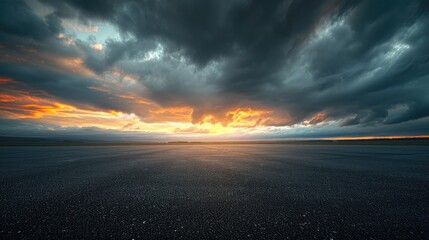 Fototapeta na wymiar Dark Dramatic Sky Horizon Epic Sunset Clouds Landscape with Black Asphalt Floor