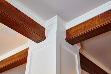 Elegant Crown Molding and Wooden Beam Detail - Interior Design Perspective