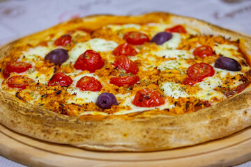 Traditional Brazilian chicken pizza with catupiry cheese, long-aged dough baked on a stone