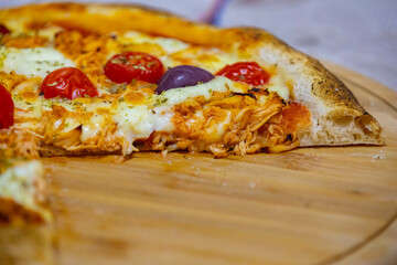 Traditional Brazilian chicken pizza with catupiry cheese, long-aged dough baked on a stone