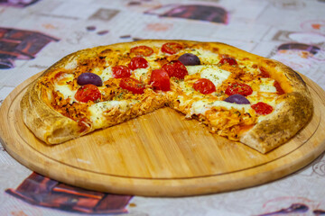 Traditional Brazilian chicken pizza with catupiry cheese, long-aged dough baked on a stone