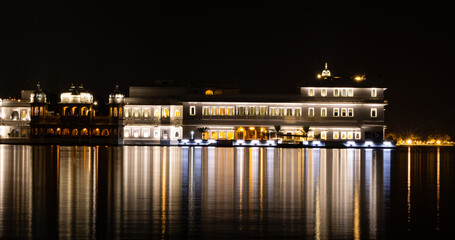 Fototapeta na wymiar Taj Lake Palace long exposure shot with light reflection at night