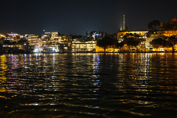 Obraz premium new modern architecture buildings at the banks of lake at night