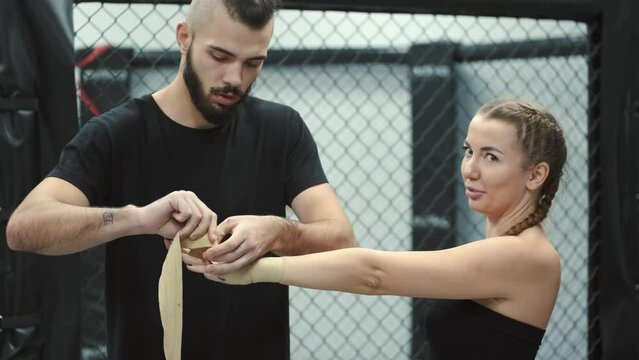 girl training with her brother improving her technique and skill in boxing, getting ready for the compition
