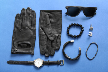 Composition with different male accessories on blue background