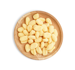 Wooden plate with tasty gnocchi on white background