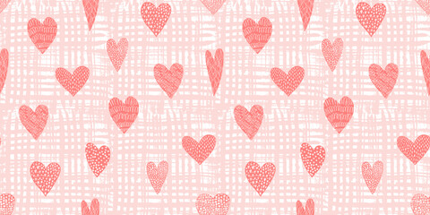 Cute seamless pattern with tender red hand drawn textured hearts on peach textured background. Lovely coral vector texture with doodle heart shapes for St. Valentines wrapping paper, textile
