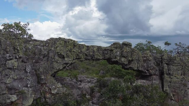 Aerial orbits rugged stone arch, el arco grande in remote Bolivia