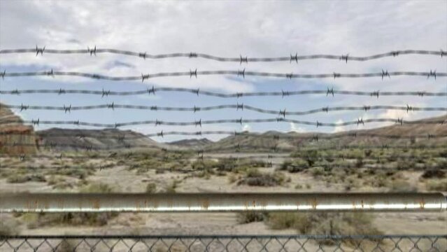 High quality 3D CGI reveal shot rising over a chainlink fence at the Area 51 military installation in a desert scene, with a UH60 Black Hawk helicopter flying overhead and into the distance