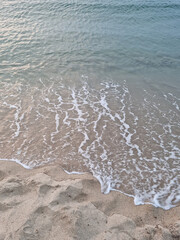 Soft beautiful ocean wave on sandy beach. Background