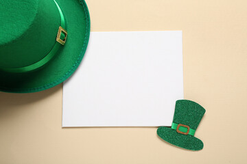 Leprechaun hat with blank card on beige background. St. Patrick's Day celebration