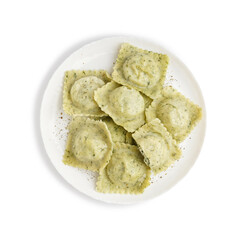 Plate of tasty ravioli with vegetables on white background