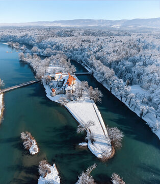 Majestic view of Otocec castle on river island on Krka river, Slovenia during winter