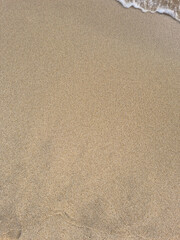 
This is a close-up of the beach sand and waves.