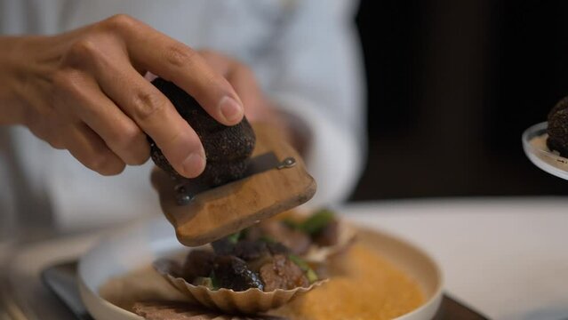 Chef cutting truffle