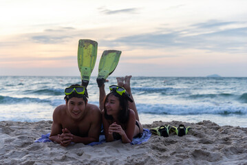 Enjoy happy vacations on beach. Young asia people man and woman honeymoon love and relax together...