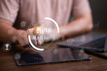 Digital marketing concept, businessman using laptop and tablet with Digital marketing on virtual screen display, online marketing, social, online.