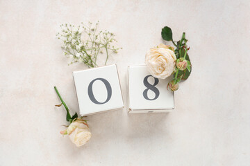 Cube calendar with date 8 MARCH, beautiful roses and gypsophila flowers on white background....