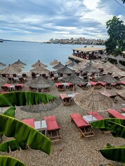 beach with umbrellas and chairs
